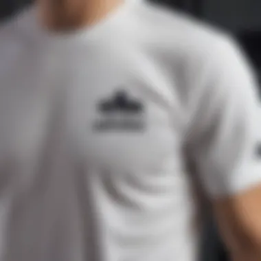 Detailed view showcasing the stitching and fit of the Adidas white t-shirt