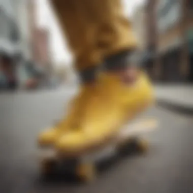 Adidas yellow shoes on a skateboard in an urban setting.