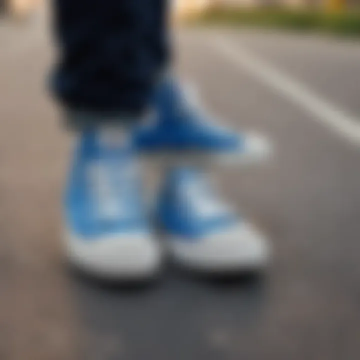 Close-up view of blue Converse shoes on a skateboard