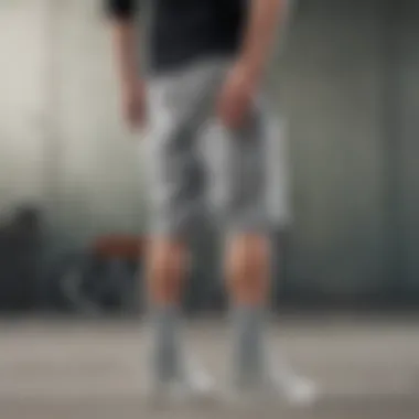 Collection of gray Nike sweatshorts styled with skate accessories