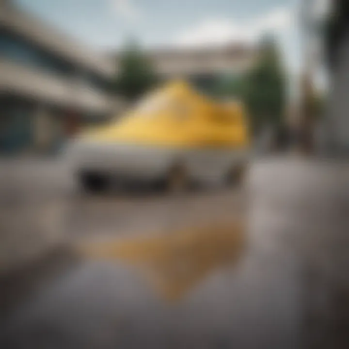 A pair of yellow and white Vans on a skateboard, highlighting their use in skateboarding.