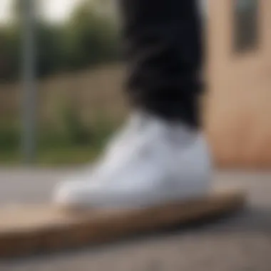 Skateboarder performing tricks while wearing Adidas White Superstar shoes