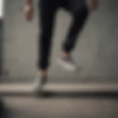 Skateboarder performing a trick while wearing Vans Slip-On Black Checker shoes