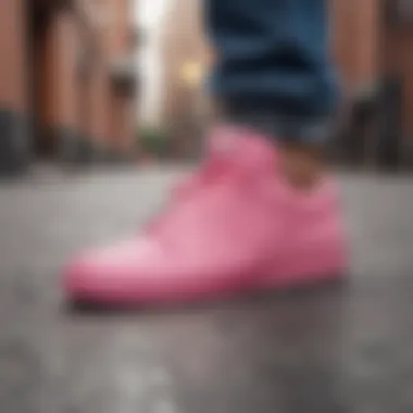 Skater showcasing bubble gum pink Nikes in urban setting