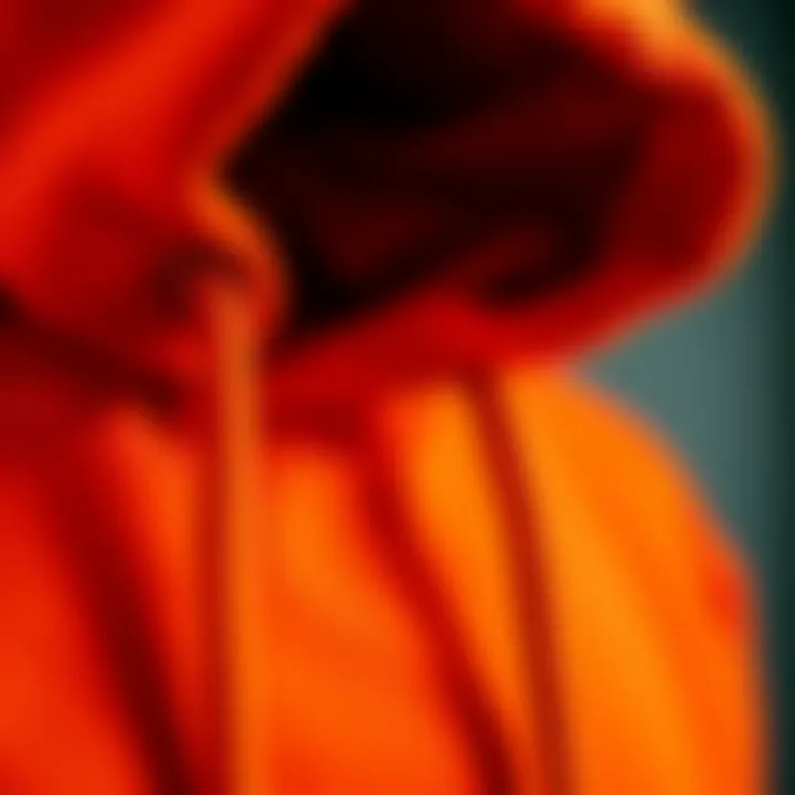 Fashion Meets Function: The Texture of a Dark Orange Hoodie Close-up of the fabric texture of a dark orange hoodie