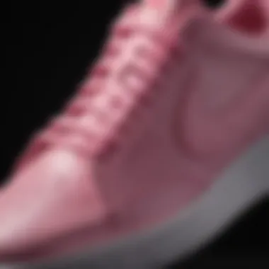 Close-up of the pink swoosh on Nike sneakers