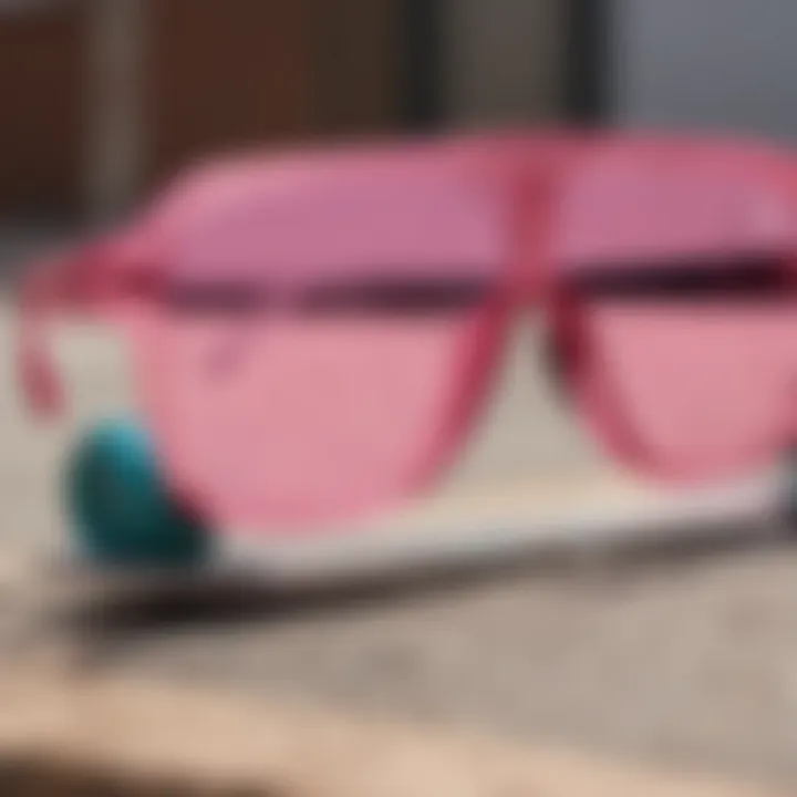 Close-up of pink star glasses resting on a skateboard deck