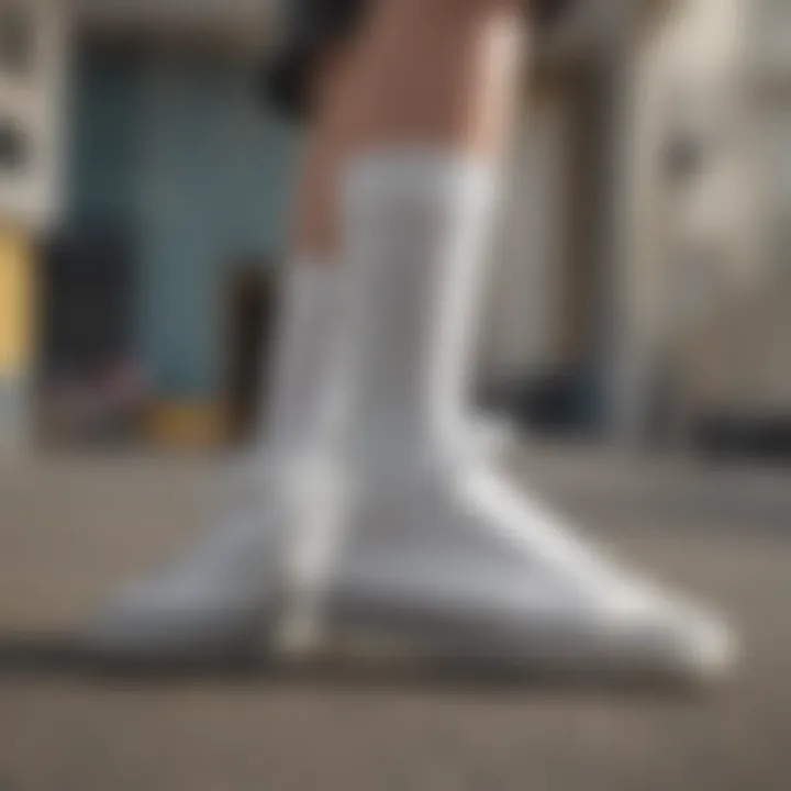 Close-up of white above ankle socks paired with skate shoes