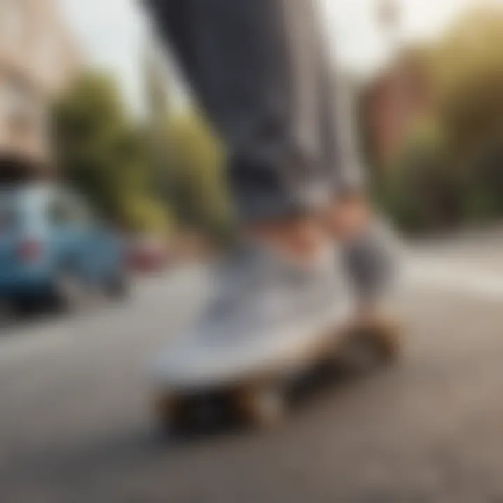 A pair of grey checkered Vans on a skateboard